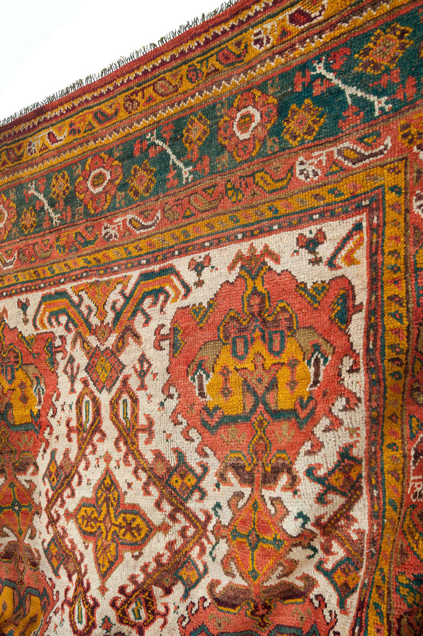 Carpets of this type were woven in western Anatolia since the 16th century. 'Turkey' carpets are often ornate by Ottoman court motifs which have morphed with European-influenced decors, as often these were commissioned by the west and offered a more